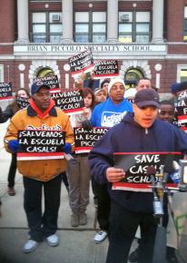 Parents and supporters speak to the press outside the Piccolo elementary school in Chicago