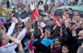 Supporters celebrate the news that Samer Issawi may soon be released