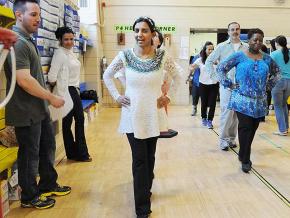 Physical therapists lead a staff exercise in Queens, New York